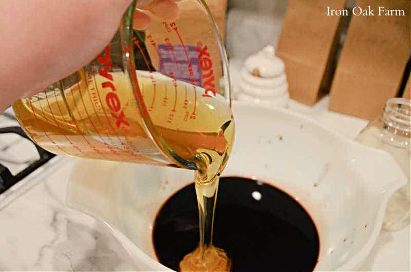 Adding the raw organic honey to the elderberry juice
